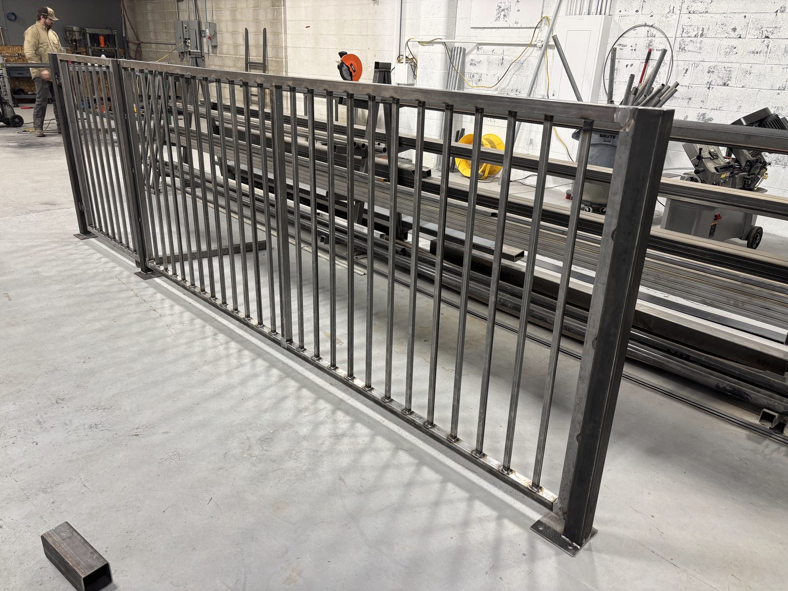 MTJ Welding shop interior — fabricating long custom steel railing panels in Salt Lake City