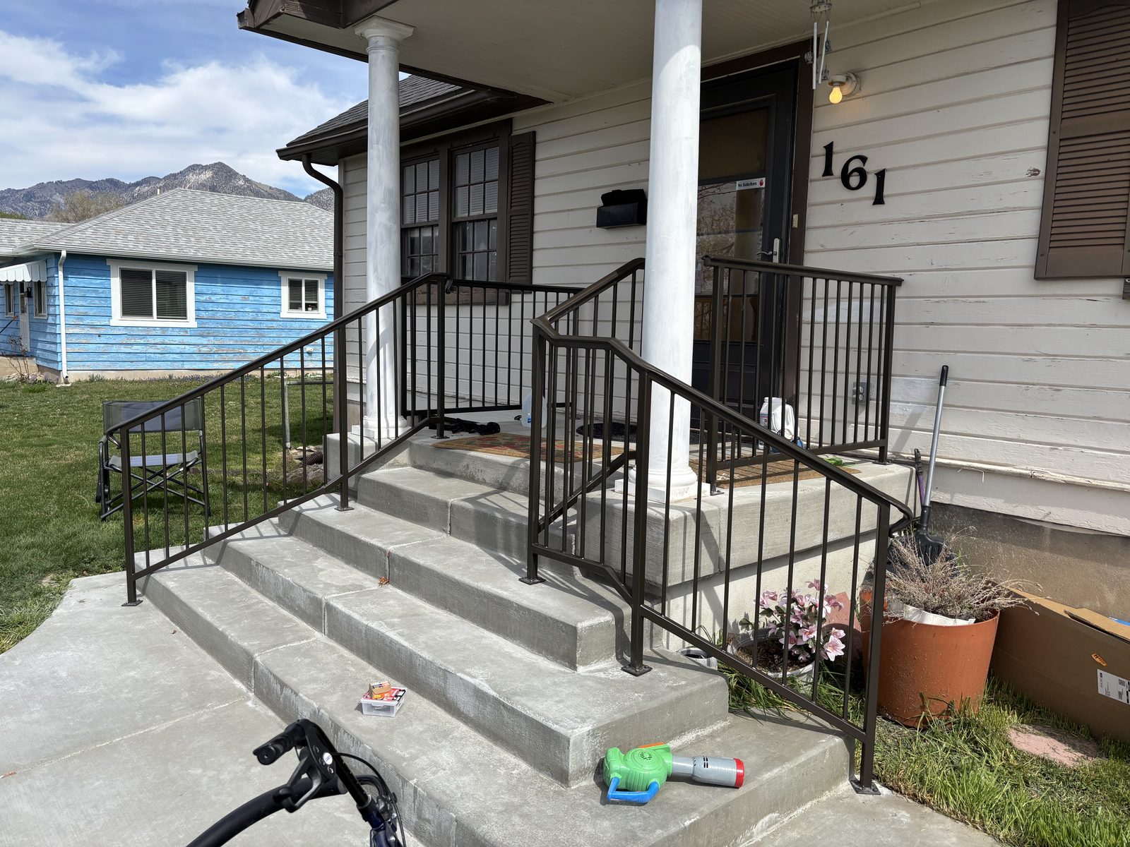 Front porch handrails with mountain backdrop